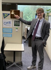 UMKC Expungement Clinic student, Garrison Priddle, rings the expungement bell after successful day in court.